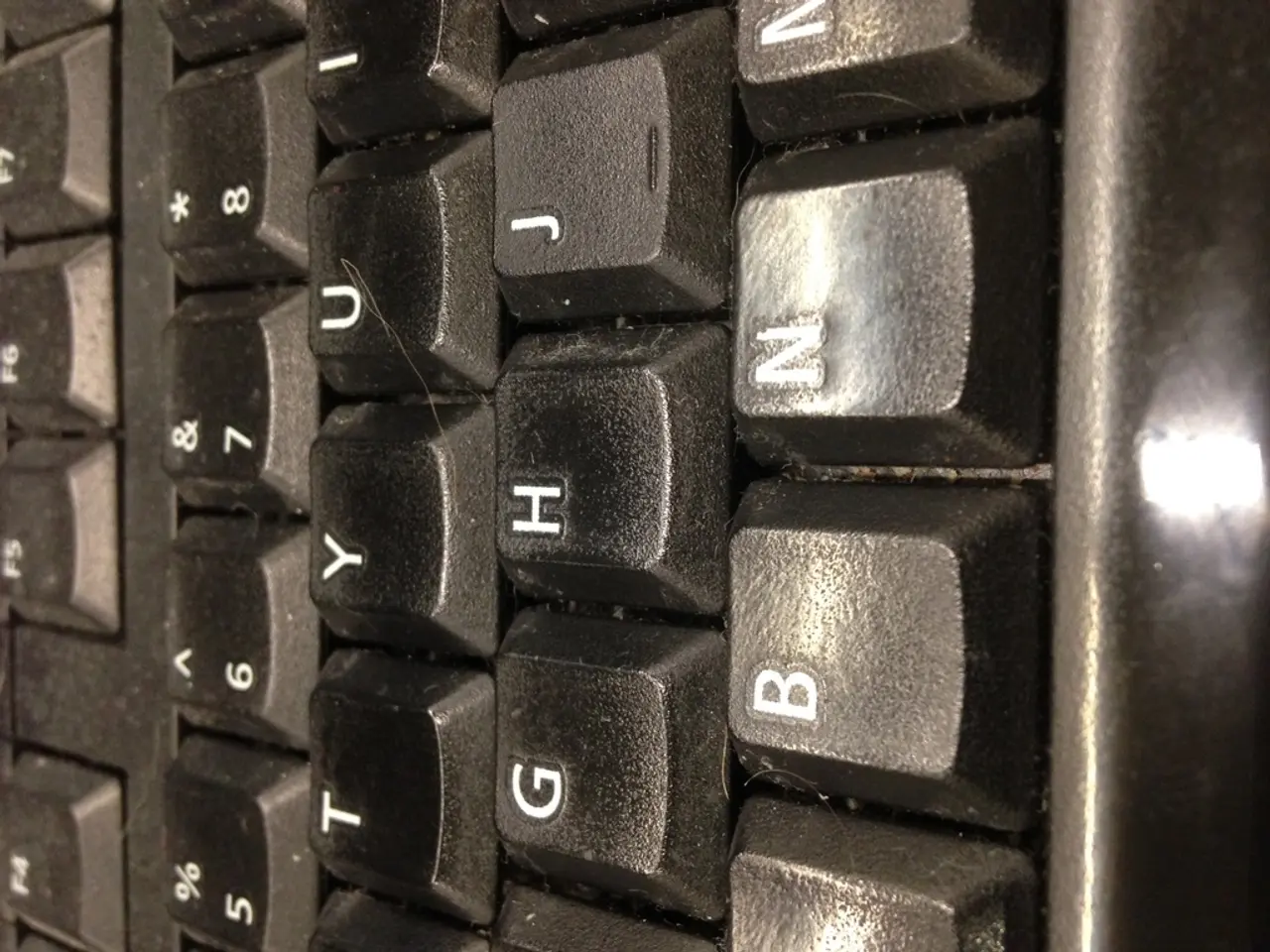 In the given image i can see a keyboard and some letters on it.