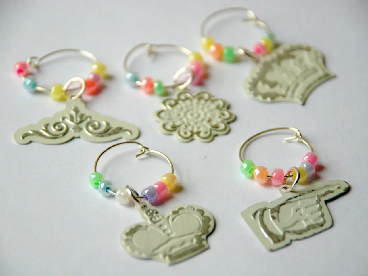 In this image there are five earrings on an object.