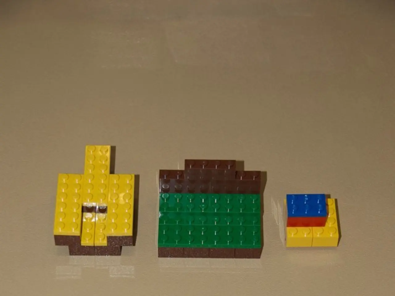 In this image we can see Lego blocks on the surface.