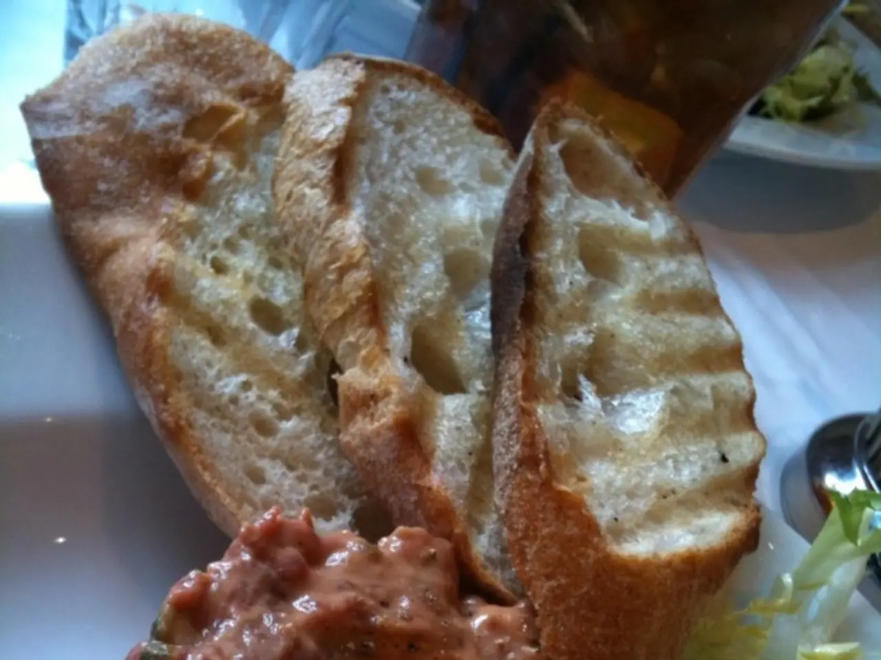 In this picture I can observe some food which is in brown and green color. In the top of the...