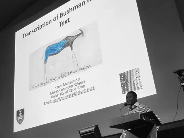 At the bottom of the image there is a podium with mic. Behind the podium there is a man. Beside him...